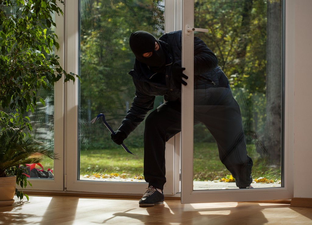 burglar entering a home