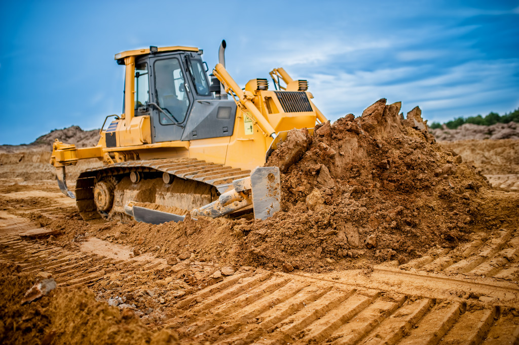 An excavator working on new land