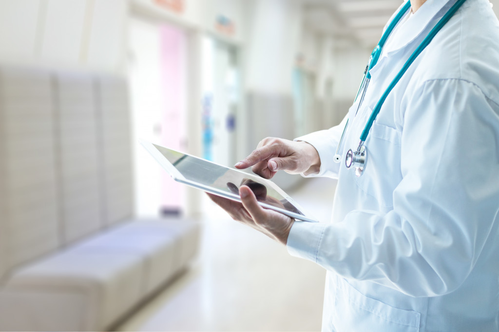 a modern healthcare provider using a digital tablet